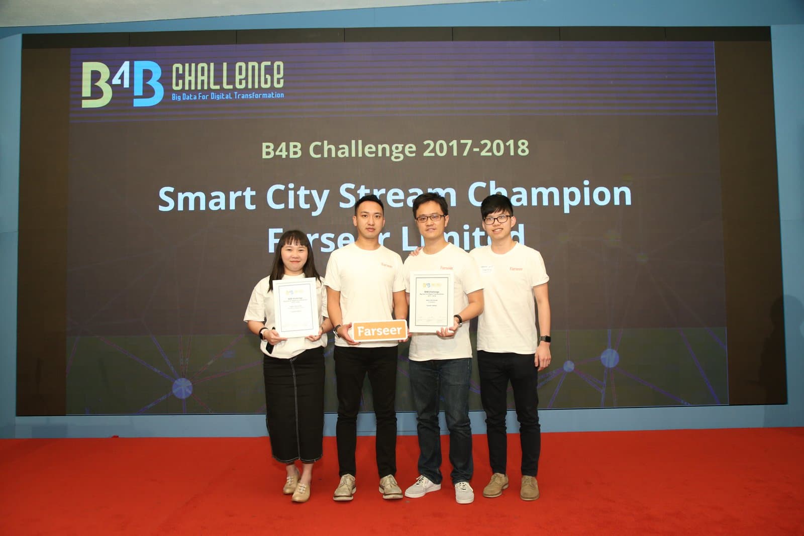 The Smart City Stream champion team holding certificates on stage at B4B Challenge 2017–2018